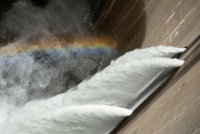 Hydrodam with rainbow over water