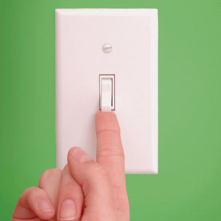 switch on wall with hand